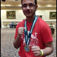 39. Adham Hussain with his Light Contact Team Silver Medal.PNG